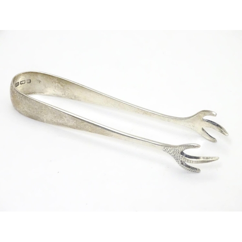 276 - Silver sugar tongs with bird’s claw formed grips.  Hallmarked Birmingham 1938 maker Barker Bros Silv... 