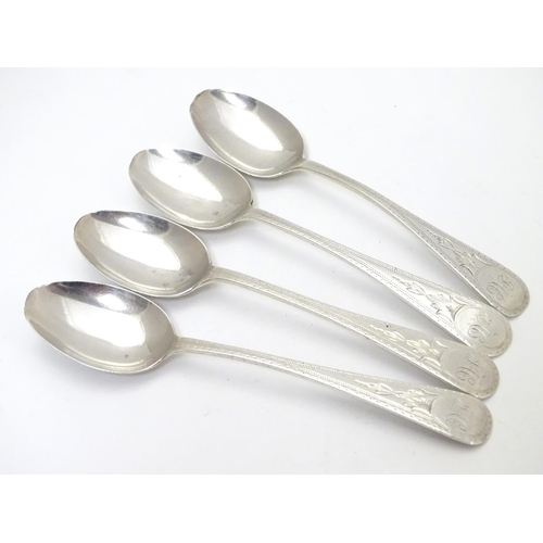 283 - A set of 4 Victorian silver Old English pattern teaspoons with bright cut engraved decoration . hall... 