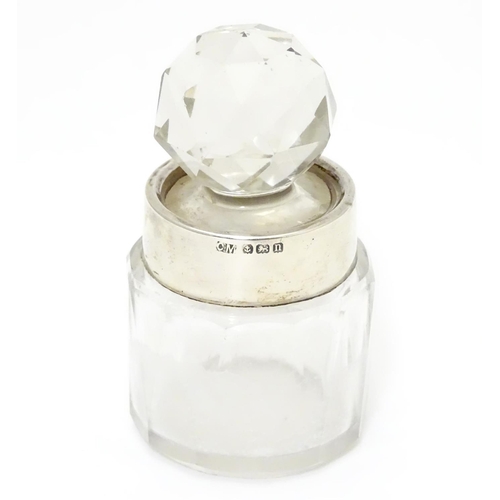 287 - A cut glass scent/salts bottle with stopper and silver collar. Hallmarked Birmingham 1912 maker Char... 