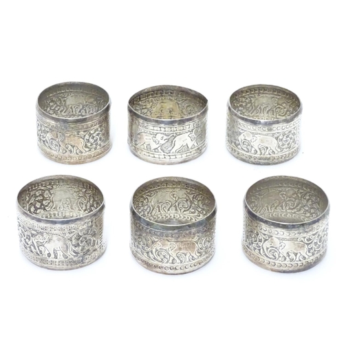 335 - A set of 6 Indian white metal napkin rings with elephant decoration.