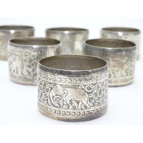 335 - A set of 6 Indian white metal napkin rings with elephant decoration.