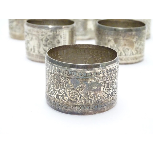 335 - A set of 6 Indian white metal napkin rings with elephant decoration.