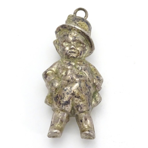 336 - A novelty silver plate rattle formed as a young child 2 1/4