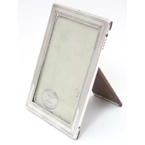 338 - A photograph frame with silver surround hallmarked Birmingham 1918 maker William Neale & Son Ltd. 6