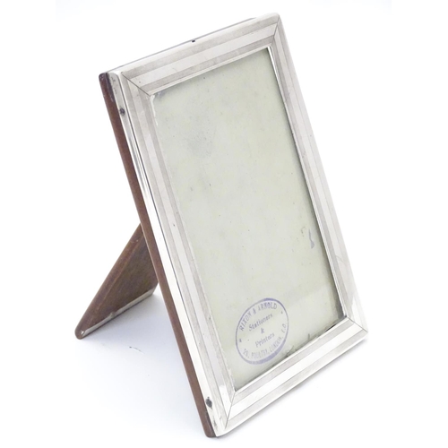 338 - A photograph frame with silver surround hallmarked Birmingham 1918 maker William Neale & Son Ltd. 6