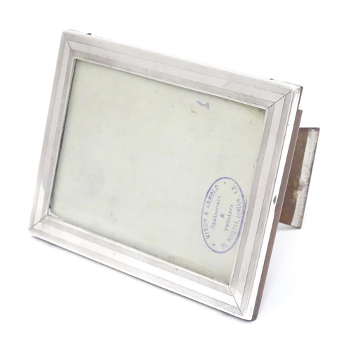 338 - A photograph frame with silver surround hallmarked Birmingham 1918 maker William Neale & Son Ltd. 6