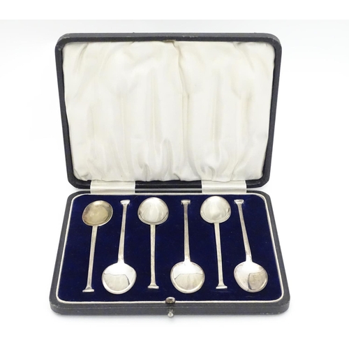 343 - A cased set of six silver coffee spoons with Art Deco seal-top type ends. Hallmarked Chester 1923 ma... 