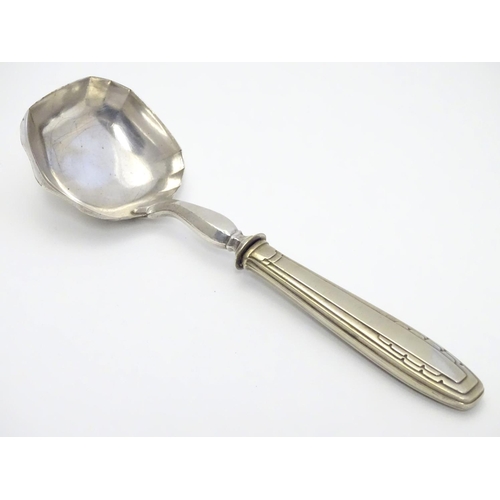 345 - A Continental Art Deco silver plate ladle. Approx 9