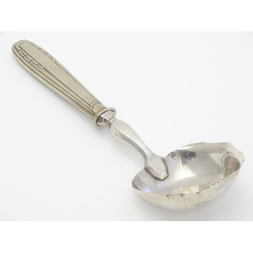 345 - A Continental Art Deco silver plate ladle. Approx 9