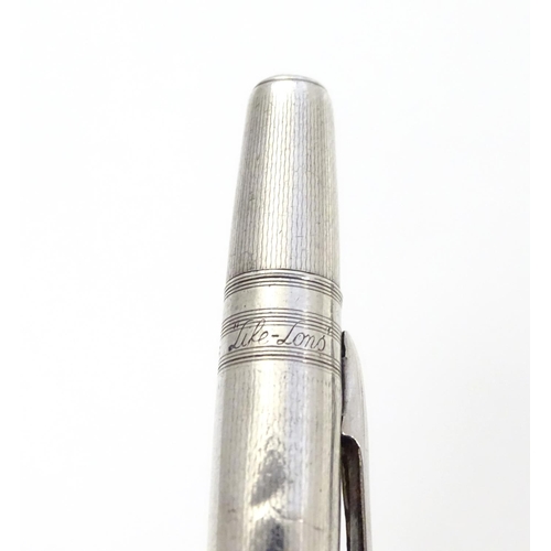 349 - A Sterling silver ' Life Long' propelling pencil with engine turned decoration Approx 4 3/4