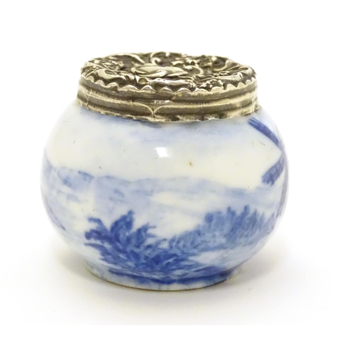 350 - An early 20thC ceramic pot with Dutch landscape decoration and silver lid hallmarked London c.1904. ... 