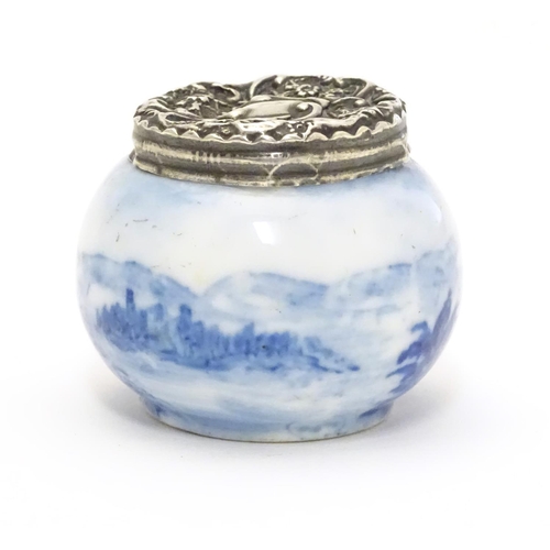 350 - An early 20thC ceramic pot with Dutch landscape decoration and silver lid hallmarked London c.1904. ... 