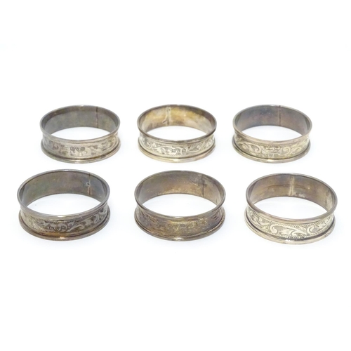 351 - Six silver napkin rings with engraved acanthus scroll decoration. Hallmarked 1919 (6)