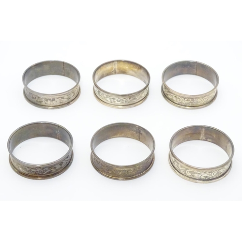 351 - Six silver napkin rings with engraved acanthus scroll decoration. Hallmarked 1919 (6)