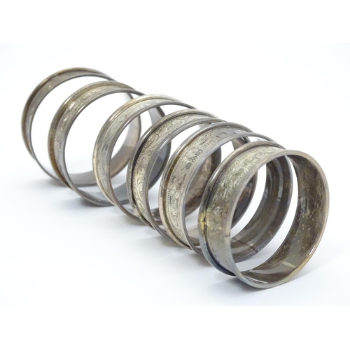 351 - Six silver napkin rings with engraved acanthus scroll decoration. Hallmarked 1919 (6)