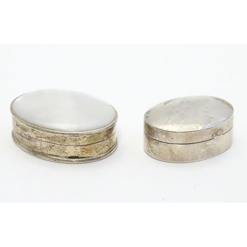 358 - A silver pill box of oval form Hallmarked Sheffield 1998 together with a .925 silver pill box with m... 