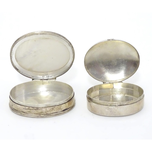 358 - A silver pill box of oval form Hallmarked Sheffield 1998 together with a .925 silver pill box with m... 