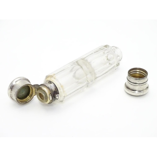 361 - A 19thC double ended scent bottle / flask the class body with white metal ends and yellow metal inse... 