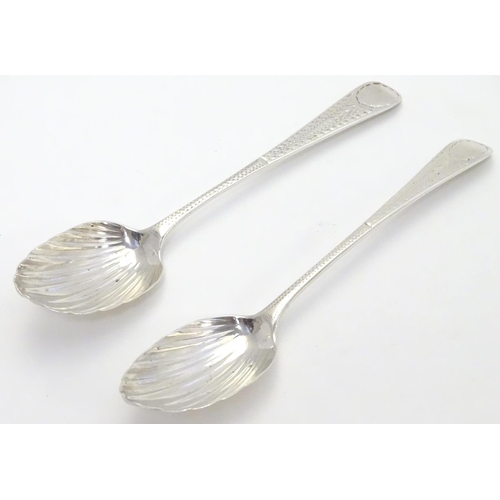 370 - Two Geo III silver teaspoons with shell formed bowls and bright cut decoration to handles. one hallm... 