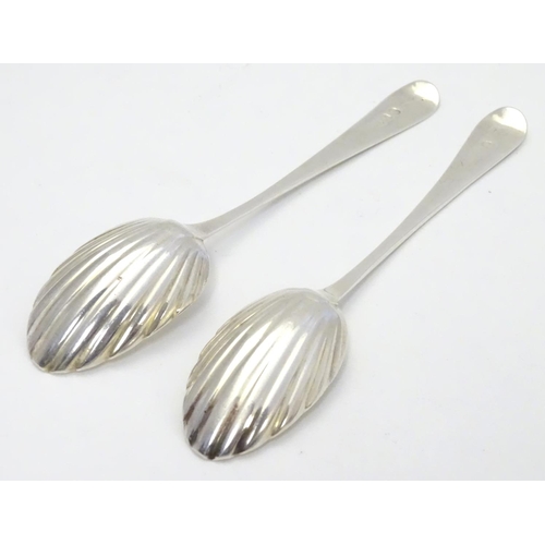 370 - Two Geo III silver teaspoons with shell formed bowls and bright cut decoration to handles. one hallm... 