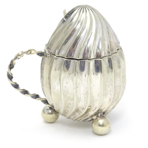 378 - A silver plate mustard pot with hinged lid loop handle and three ball feet. 3