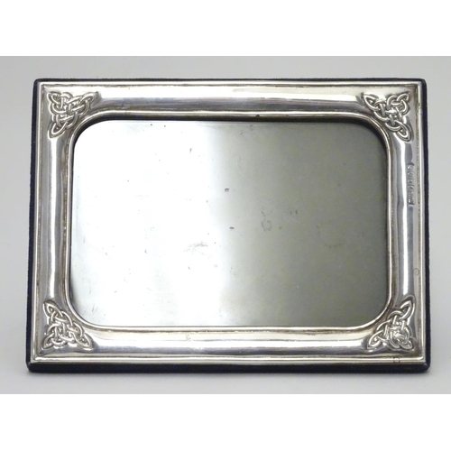 383 - An Irish photograph frame with silver surround having Celtic-style designs at each corner. Hallmarke... 