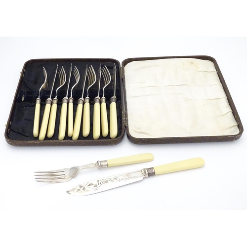 384 - A cased set of fish knives and forks (6+6), each with silver collar hallmarked Sheffield 1926 maker ... 