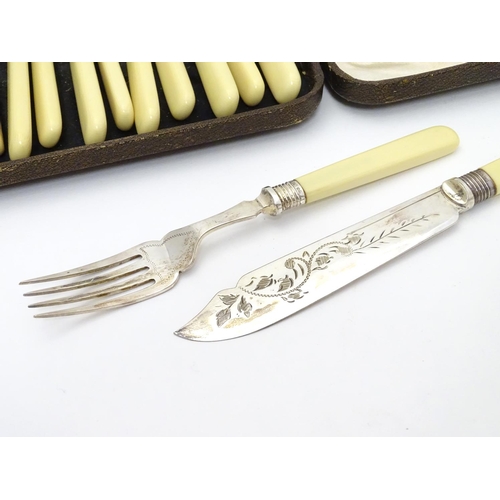 384 - A cased set of fish knives and forks (6+6), each with silver collar hallmarked Sheffield 1926 maker ... 