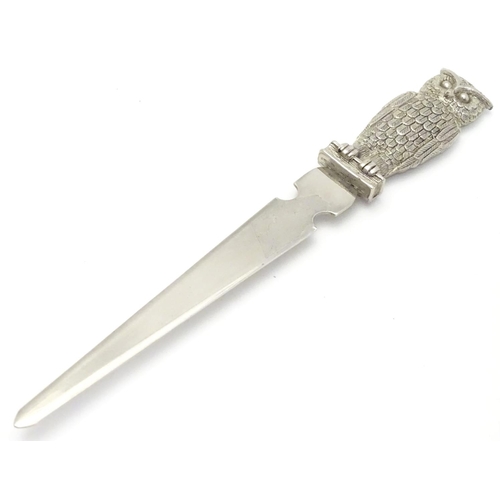 386 - A silver plate letter opener / paper knife. The handle formed as an owl. 7