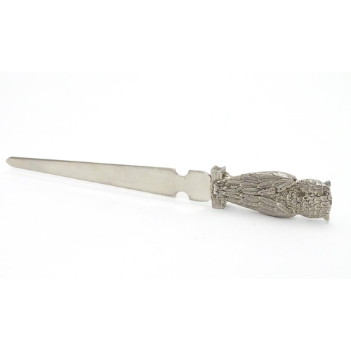 386 - A silver plate letter opener / paper knife. The handle formed as an owl. 7