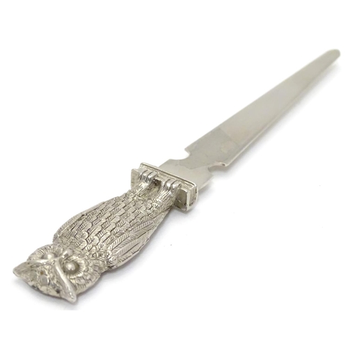 386 - A silver plate letter opener / paper knife. The handle formed as an owl. 7