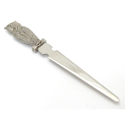 386 - A silver plate letter opener / paper knife. The handle formed as an owl. 7