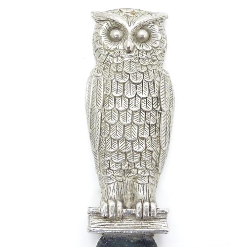 386 - A silver plate letter opener / paper knife. The handle formed as an owl. 7