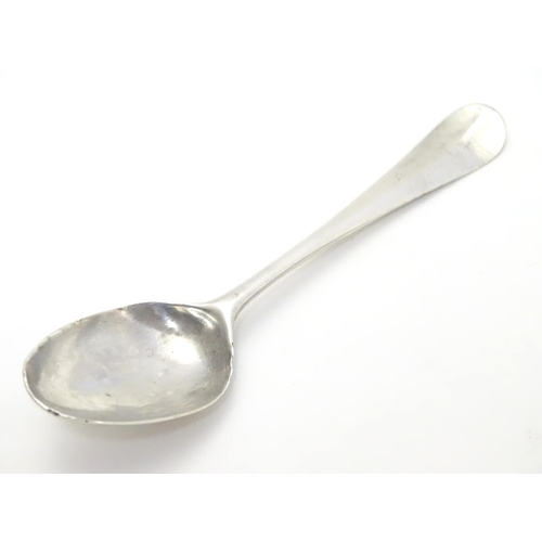 388 - A Geo III Hanoverian spoon with fancy / picture back scallop shell motif. Maker T.W. Approx 4 1/4