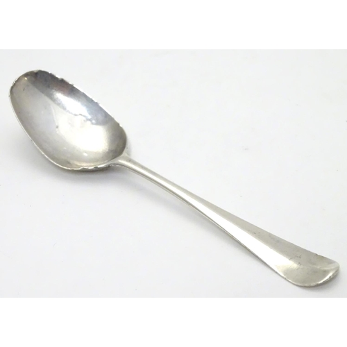 388 - A Geo III Hanoverian spoon with fancy / picture back scallop shell motif. Maker T.W. Approx 4 1/4