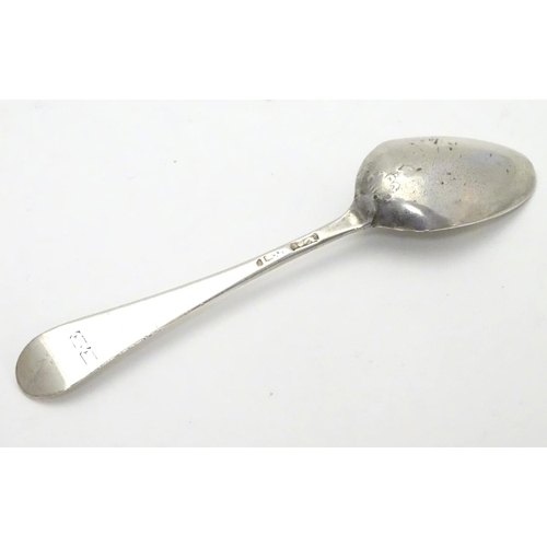 388 - A Geo III Hanoverian spoon with fancy / picture back scallop shell motif. Maker T.W. Approx 4 1/4