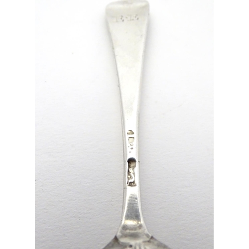 388 - A Geo III Hanoverian spoon with fancy / picture back scallop shell motif. Maker T.W. Approx 4 1/4