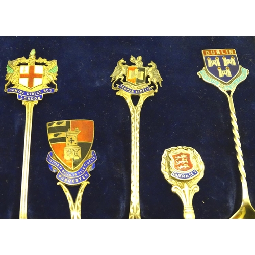 390 - 12 assorted silver souvenir teaspoons  with enamel direction to handles depicting town coat of arms ... 