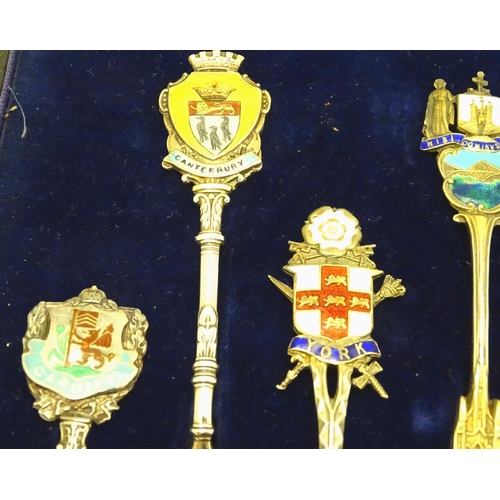 390 - 12 assorted silver souvenir teaspoons  with enamel direction to handles depicting town coat of arms ... 