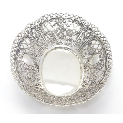 391 - A Continental 925 silver dish with pierced and repoussee floral decoration. Approx. 7” long