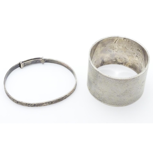 395 - An Art Deco silver napkin ring with engine turned decoration. Hallmarked Sheffield 1933 maker Thomas... 