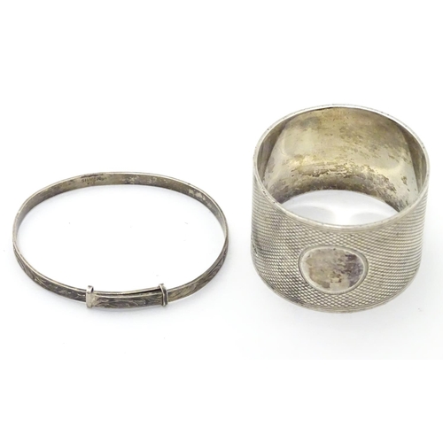 395 - An Art Deco silver napkin ring with engine turned decoration. Hallmarked Sheffield 1933 maker Thomas... 