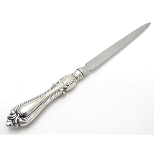 396 - Assorted items to include a silver handled letter opener, together with a Victorian silver butter kn... 