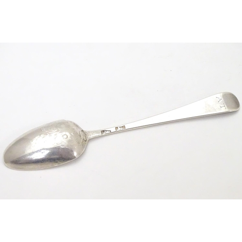 407 - An early Geo III silver Hanoverian teaspoon with picture / fancy back depicting a flower spray stemm... 