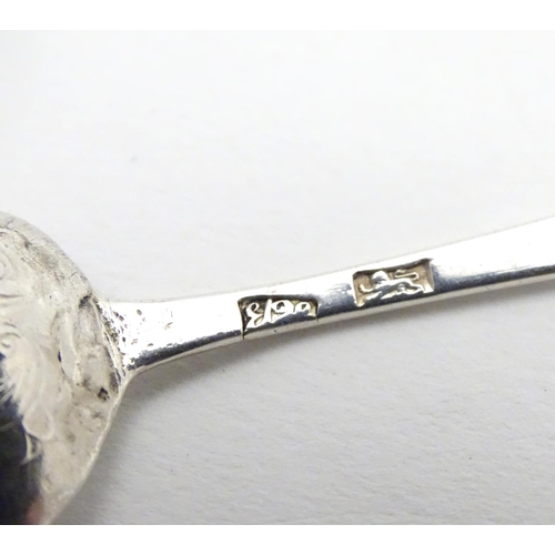 407 - An early Geo III silver Hanoverian teaspoon with picture / fancy back depicting a flower spray stemm... 