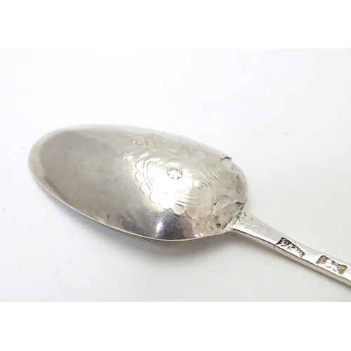 407 - An early Geo III silver Hanoverian teaspoon with picture / fancy back depicting a flower spray stemm... 