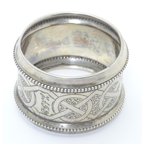 410 - A ate 19thC continental silver large napkin ring with engraved decoration. Possibly Dutch. Approx 2 ... 