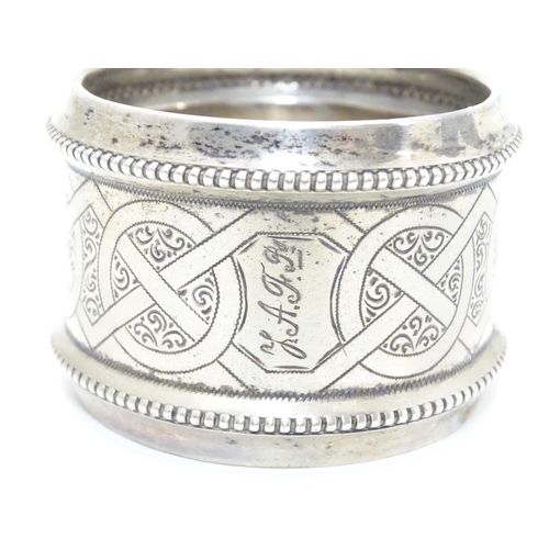 410 - A ate 19thC continental silver large napkin ring with engraved decoration. Possibly Dutch. Approx 2 ... 