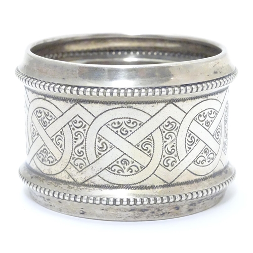 410 - A ate 19thC continental silver large napkin ring with engraved decoration. Possibly Dutch. Approx 2 ... 