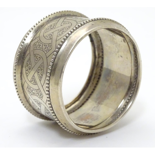 410 - A ate 19thC continental silver large napkin ring with engraved decoration. Possibly Dutch. Approx 2 ... 